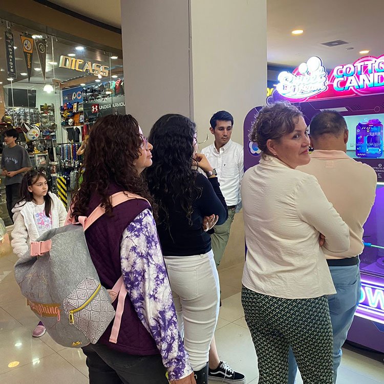 Modern cotton candy vending machine in a mall setting
