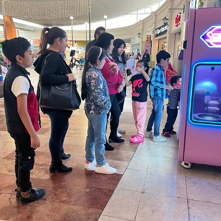 A-modern-commercial-blue-cotton-candy-machine-in-operation