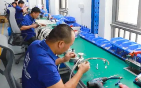 Inside view of a vending machine manufacturing facility with quality control checks
